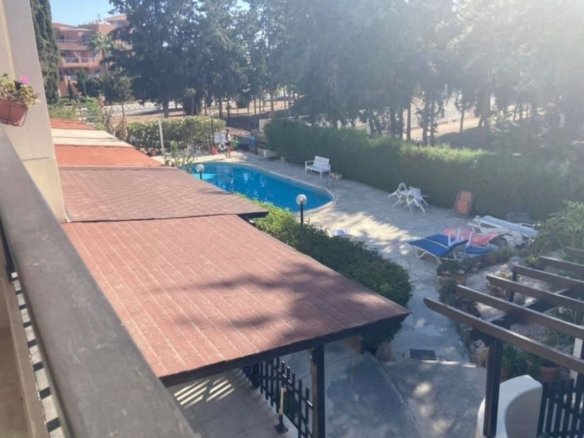 Pool view on i bedroom apartment in Kato Paphos